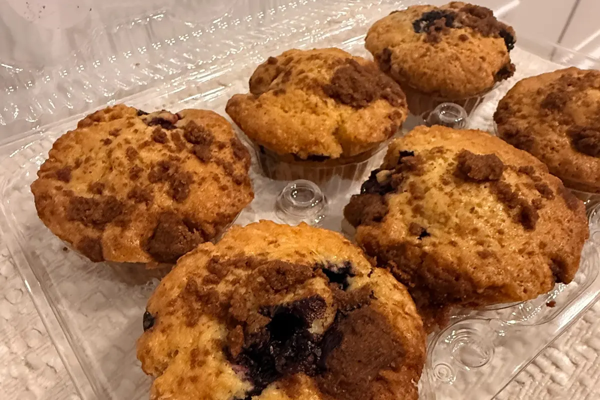 Six freshly baked blueberry sourdough muffins